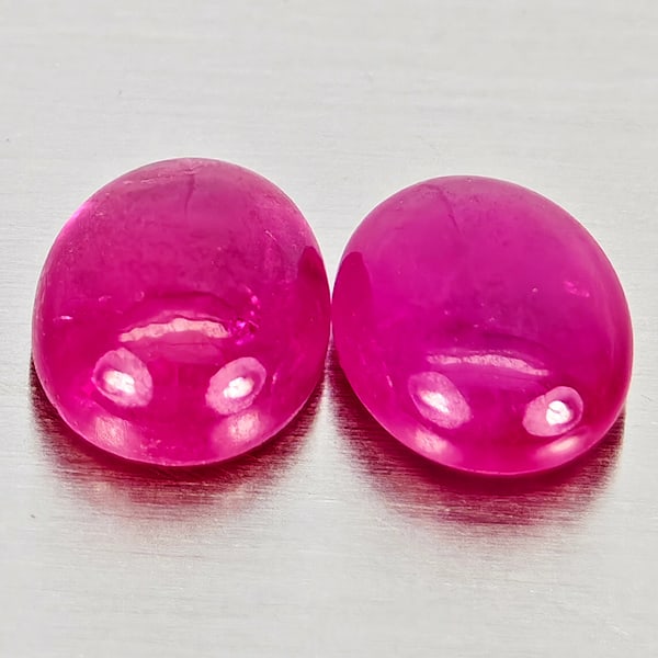 Natural Pink Red Jonson Ruby 0.98 Ct. 2 Pcs. Oval Cabochon Shape 5.2 x 4.2 Mm.: Product ID: 805935684 Product Name: Natural Ruby Weight: 0.98 CT. Size: 5.2 x 4.2 x 2.4 MM. Shape: Oval Cabochon Color: Pink Red Clarity:Semi - Transparent Luster: Good Gems Origin: Mozambique Treatme