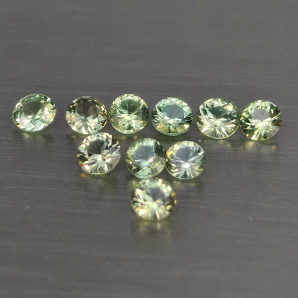 Natural Green Songea Sapphire Gemstones 0.67 Ct. 10 Pcs. Round Diamond Cut 2.5 Mm.: Product ID: 806130492 Product Name: Natural Blue Sapphire Weight: 0.67 CT. Size: 2.5 x 2.5 x 1.8 MM. Shape: Round Diamond Cut Color: Green Clarity:SI1 Luster: Good Gems Origin: Tanzania Treatment: Hea