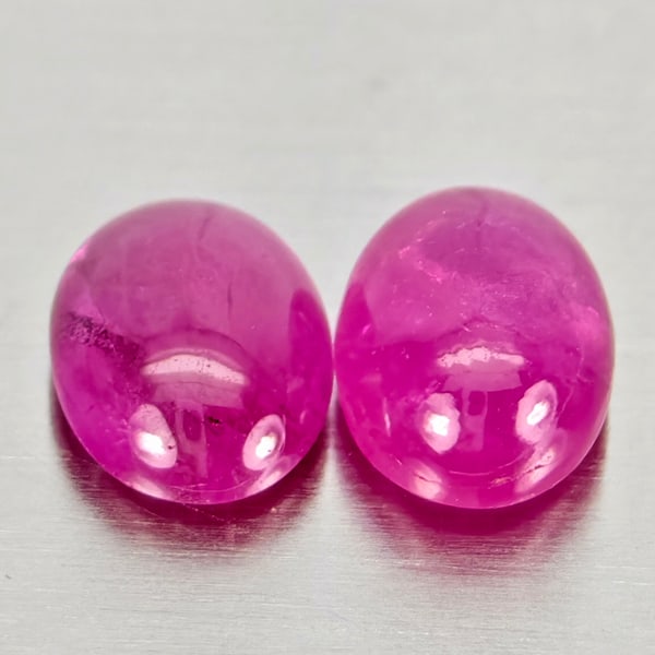Natural Pink Red Jonson Ruby Gemstones 1.30 Ct. 2 Pcs. Oval Cabochon Shape 5.8 x 4.2 Mm.: Product ID: 805935741 Product Name: Natural Ruby Weight: 1.30 CT. Size: 5.8 x 4.2 x 2.5 MM. Shape: Oval Cabochon Color: Pink Red Clarity:Semi - Transparent Luster: Good Gems Origin: Mozambique Treatme