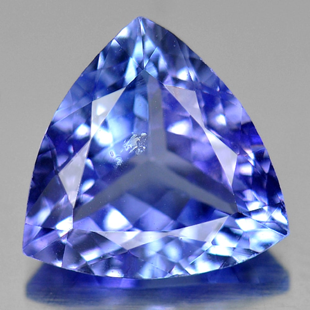 Natural Blue Tanzanite Gemstones1.38 Ct. Trilliant Shape 7.7 x 7.6 Mm.: Product ID: 807009471 Product Name: Natural Tanzanite Weight: 1.38 CT. Size: 7.7 x 7.6 x 3.8 MM. Shape: Trilliant Color: Violet Blue Clarity:SI1 Luster: Good Gems Origin: Tanzania Treatment: Heated Cr