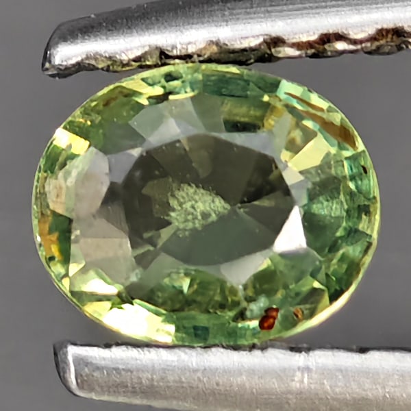 Natural Green Songea Sapphire Gemstones 0.57 Ct. Oval Shape 5.1 x 4.2 Mm.: Product ID: 806163007 Product Name: Natural Green Sapphire Weight: 0.57 CT. Size: 5.1 x 4.2 x 2.8 MM. Shape: Oval Shape Color: Green Clarity:VSI Luster: Good Gems Origin: Tanzania Treatment: Heated Cr