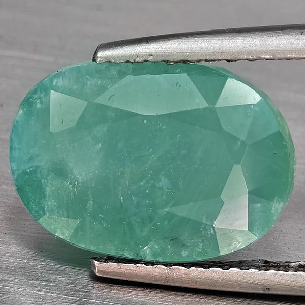 Natural Green Blueish Grandidierite Gemstones 6.99 Ct . Oval Shape 13 x 9.4 Mm.: Product ID: 803100010 Product Name: Natural Tsavorite Weight: 6.99 CT. Size: 13 x 9.4 x 8.2 MM. Shape: Oval Shape Color: Green Blueish Clarity:SI1 Luster: Good Gems Origin: Madagascar Treatment: Unhea