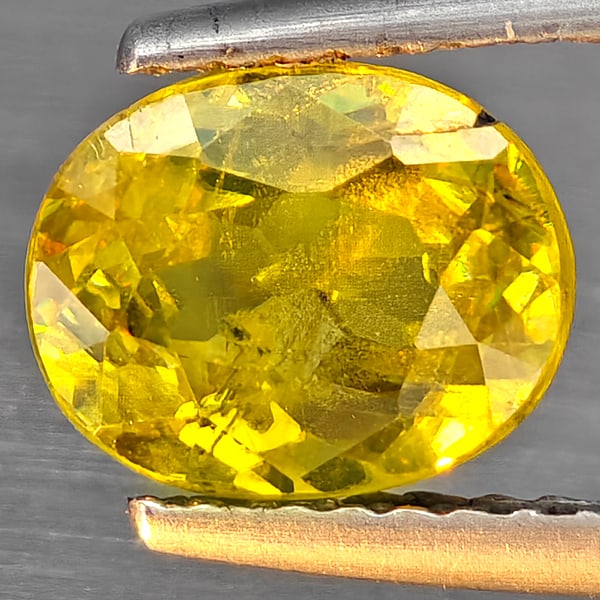 Natural Multi-Color Sphene Gemstones With Rainbow Spark 1.87 Ct. Oval Shape 8 x 6.5 Mm.: Product ID: 806509114 Product Name: Natural Sphene Weight: 1.87 CT. Size: 8 x 6.5 x 4.5 MM. Shape: Oval Shape Color: Multi-Color Clarity:SI1 Luster: Good Gems Origin: Madagascar Treatment: Unheated Cr