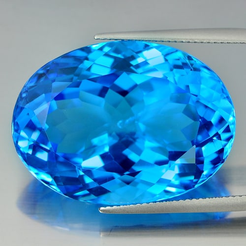 Natural Swiss Blue Topaz Gemstones 63.12 Ct. Clean Oval Shape 30 x 22 Mm.: Product ID: 807155605 Product Name: Natural Blue Topaz Weight: 63.12 CT. Size: 30 x 22 x 13.7 MM. Shape: Oval Color: Swiss Blue Clarity: IF Luster: Very Good Gems Origin: Brazil Treatment: Treated Cry