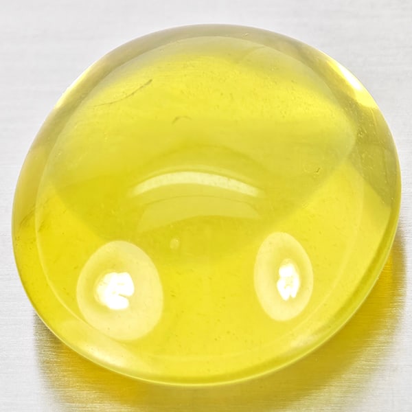Natural Yellow Lemon Quartz Gemstones 37.51 Ct. Oval Cabochon Shape 22 x 20 Mm.: Product ID: 805530004 Product Name: Natural Quartz Weight: 37.51 CT. Size: 22 x 20 x 12.5 MM. Shape: Oval Cabochon Color: Yellow Lemon Clarity:Semi - Transparent Luster: Good Gems Origin: Brazil Treat
