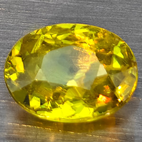 Natural Multi-Color Sphene Gemstones With Rainbow Spark 1.07 Ct. Oval Shape 7.4 x 5.9 Mm.: Product ID: 806509087 Product Name: Natural Sphene Weight: 1.07 CT. Size: 7.4 x 5.9 x 3.2 MM. Shape: Oval Shape Color: Multi-Color Clarity:SI1 Luster: Good Gems Origin: Madagascar Treatment: Unheated 