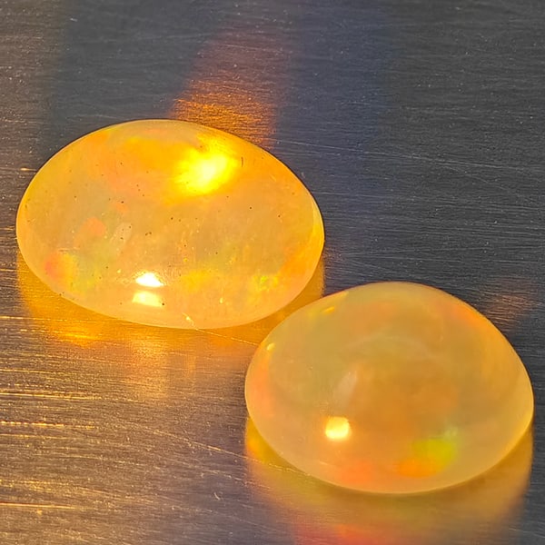 Natural Multi-Color Opal Gemstones 1.36 Ct. 2 Pcs. Oval Cabochon Shape 6.7 x 5.5 Mm.: Product ID: 818728327 Product Name: Natural Opal Weight: 1.36 CT. Size: 6.7 x 5.5 x 4 MM. Shape: Oval Cabochon Color: Multi-Color Clarity:None Luster: Good Gems Origin: Ethiopia Treatment: Unheated Cr