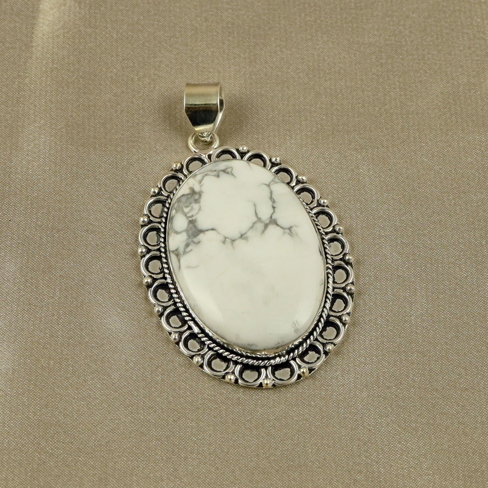 Natural Howlite Sterling Silver Plated Handmade Pendant: Product ID: 260518140605 Product - Handmade Silver Plated Pendant Metal - 92.5 Sterling Silver Plated Pendant Size - 4.5x3.5CM Gemstone - Howlite Gemstone Origin - Canada Gemstone Shape - Oval Pendant