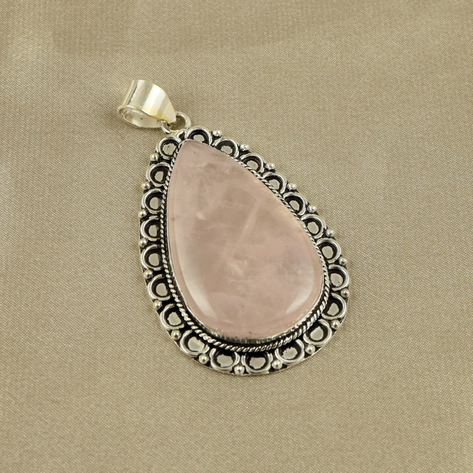 Natural A+ Rose Quartz Sterling Silver Plated Handmade Pendant: Product ID: 260518132136 Product - Handmade Silver Plated Pendant Metal - 92.5 Sterling Silver Plated Pendant Size - 5x3.5CM Gemstone - Rose Quartz Gemstone Origin - Brazil Gemstone Shape - Pear Penda