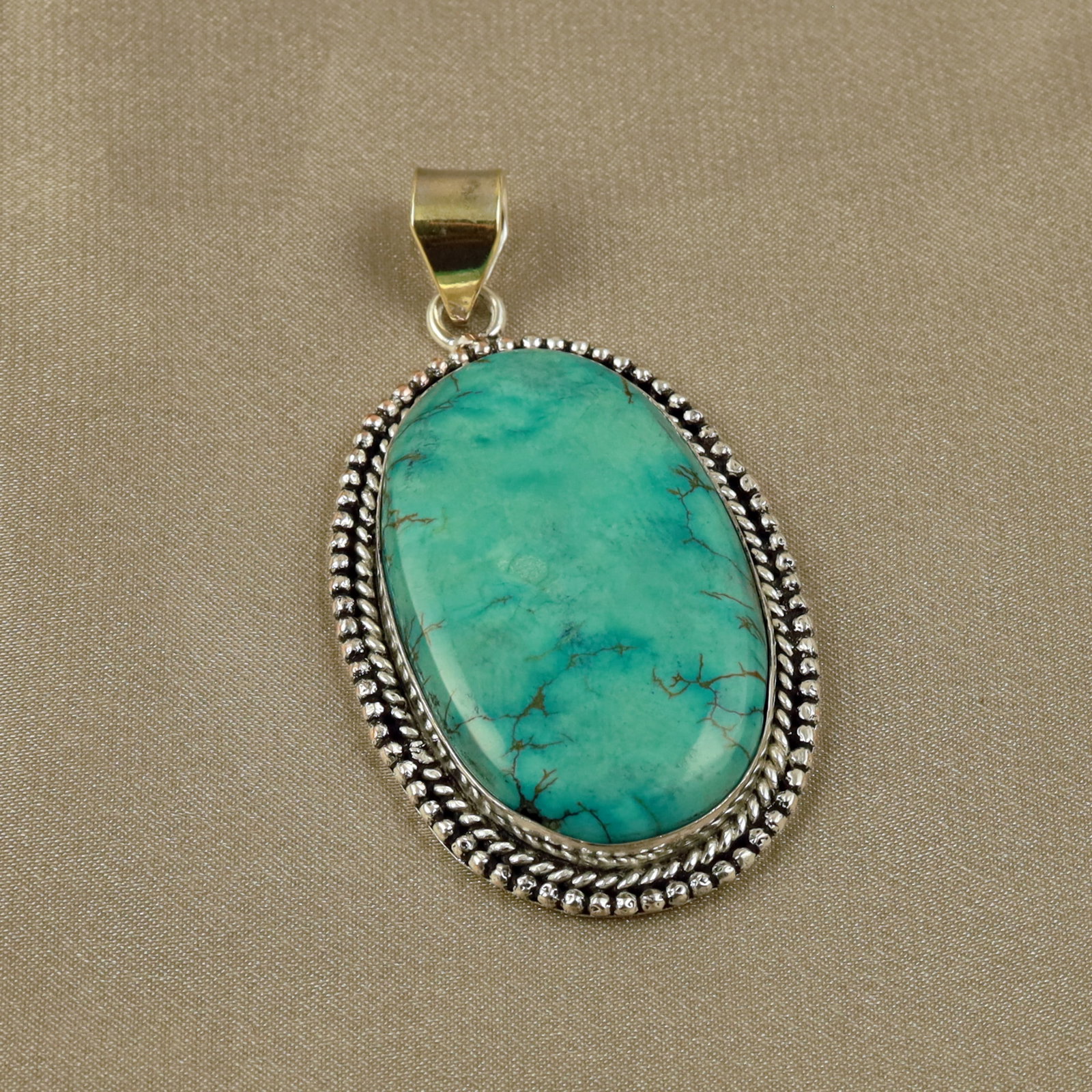 Natural Turquoise Sterling Silver Plated Handmade Pendant: Product ID: 260518134348 Product - Handmade Silver Plated Pendant Metal - 92.5 Sterling Silver Plated Pendant Size - 4.5x3CM Gemstone - Turquoise Gemstone Origin - Tibet Gemstone Shape - Oval Pendant 
