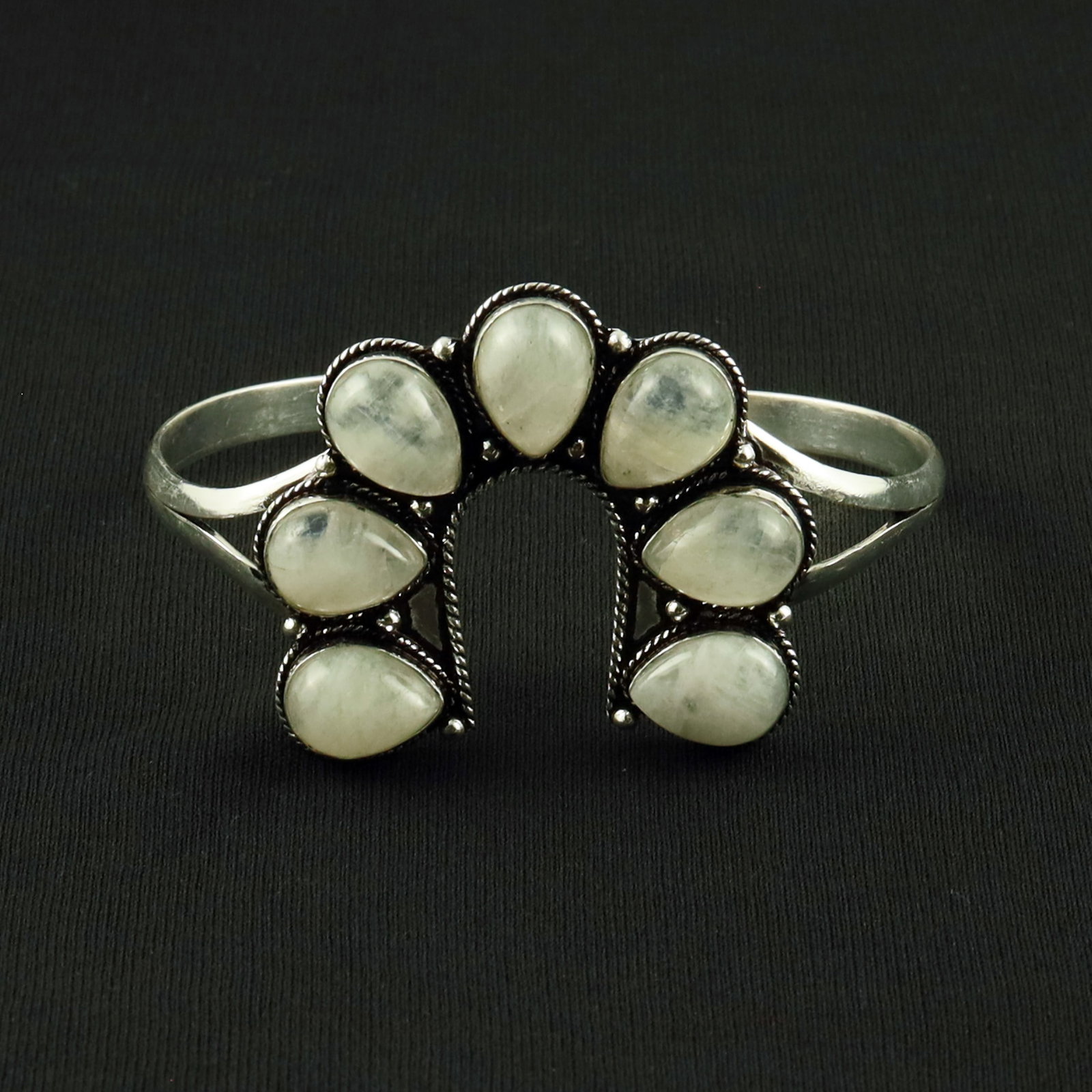 Natural Rainbow Moonstone Silver Plated Handmade Cuff Bangle: Product ID: 260617120501 Product - Handmade Silver Plated Cuff Bangle Metal - 92.5 Sterling Silver Plated Bangle Size - 7.5x5 CM (Adjustable) Gemstone - Rainbow Moonstone Gemstone Origin - India Gemst