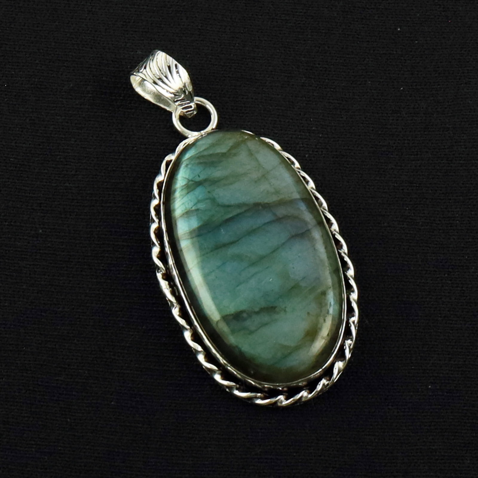 Natural Labradorite Sterling Silver Plated Handmade Pendant: Product ID: 260619172110 Product - Handmade Silver Plated Pendant Metal - 92.5 Sterling Silver Plated Pendant Size - 3.5X2 CM Gemstone - Labradorite Gemstone Origin - Canada Gemstone Shape - Oval Pend