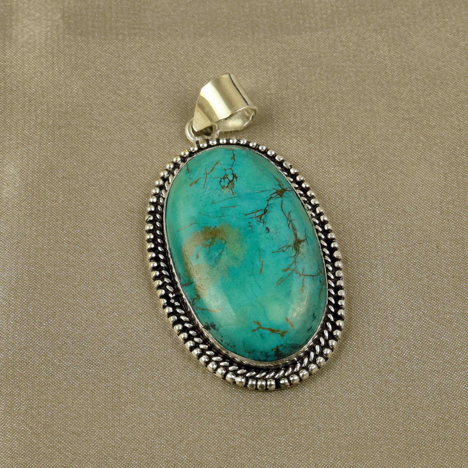 Natural Turquoise Sterling Silver Plated Handmade Pendant: Product ID: 260518134151 Product - Handmade Silver Plated Pendant Metal - 92.5 Sterling Silver Plated Pendant Size - 4.5x3CM Gemstone - Turquoise Gemstone Origin - Tibet Gemstone Shape - Oval Pendant 