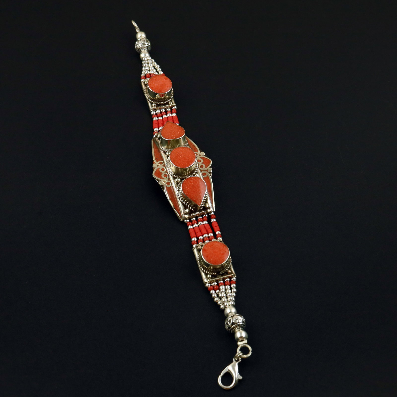 Tibetan Natural Red Coral Handmade Asian Bracelet: Product ID: 260513130903 Product - Tibetan Handmade Ethnic Bracelet Gemstone - Natural Coral Size - 7 Inch Weight - 50 Gram Approx Metal - Brass & Copper mix Metal Origin - Nepal Country/Region of Man