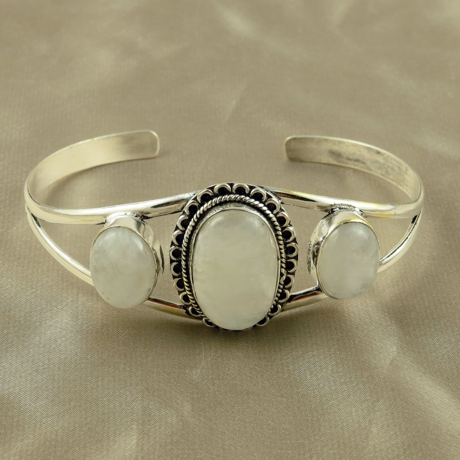 Natural Rainbow Moonstone Sterling Silver Plated Handmade Cuff Bangle: Product ID: 260521152923 Product - Handmade Silver Plated Cuff Bangle Metal - 92.5 Sterling Silver Plated Bangle Size - 7.5x5.5 CM (Adjustable) Gemstone - Rainbow Moonstone Gemstone Origin - India Gem