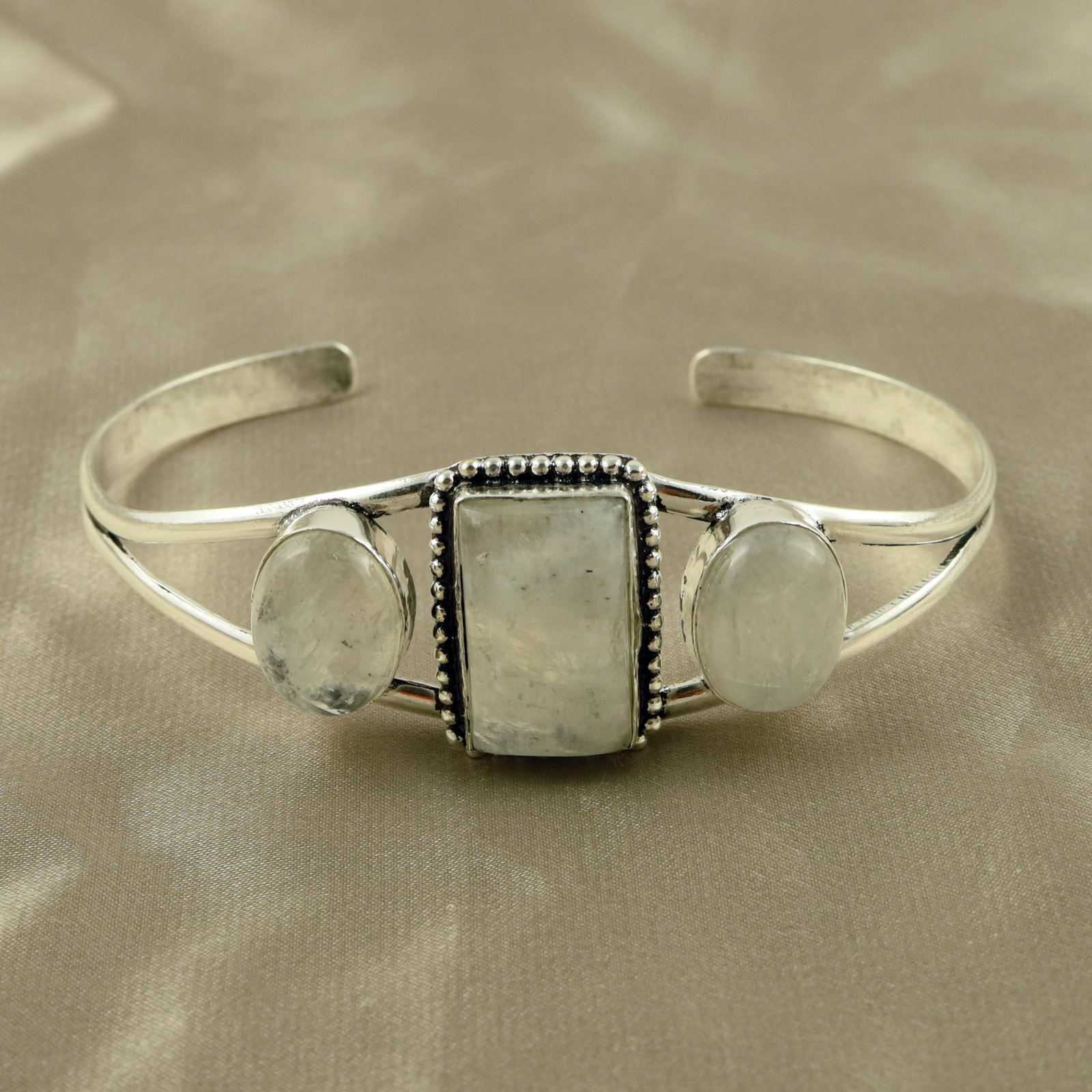 Natural Rainbow Moonstone Sterling Silver Plated Handmade Cuff Bangle: Product ID: 260521154140 Product - Handmade Silver Plated Cuff Bangle Metal - 92.5 Sterling Silver Plated Bangle Size - 7.5x5.5 CM (Adjustable) Gemstone - Rainbow Moonstone Gemstone Origin - India Gem