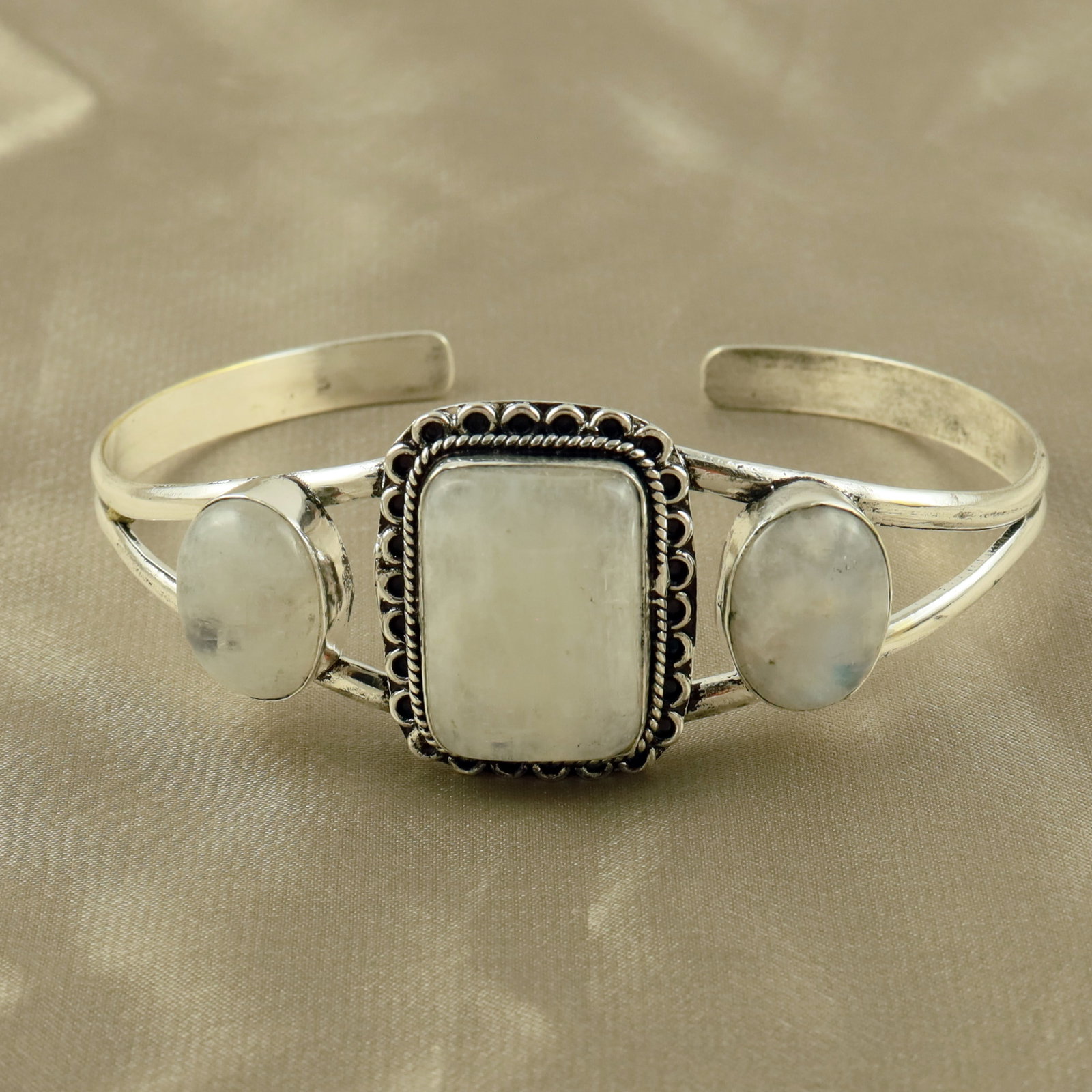 Natural Rainbow Moonstone Sterling Silver Plated Handmade Cuff Bangle: Product ID: 260521153952 Product - Handmade Silver Plated Cuff Bangle Metal - 92.5 Sterling Silver Plated Bangle Size - 7.5x5.5 CM (Adjustable) Gemstone - Rainbow Moonstone Gemstone Origin - India Gem