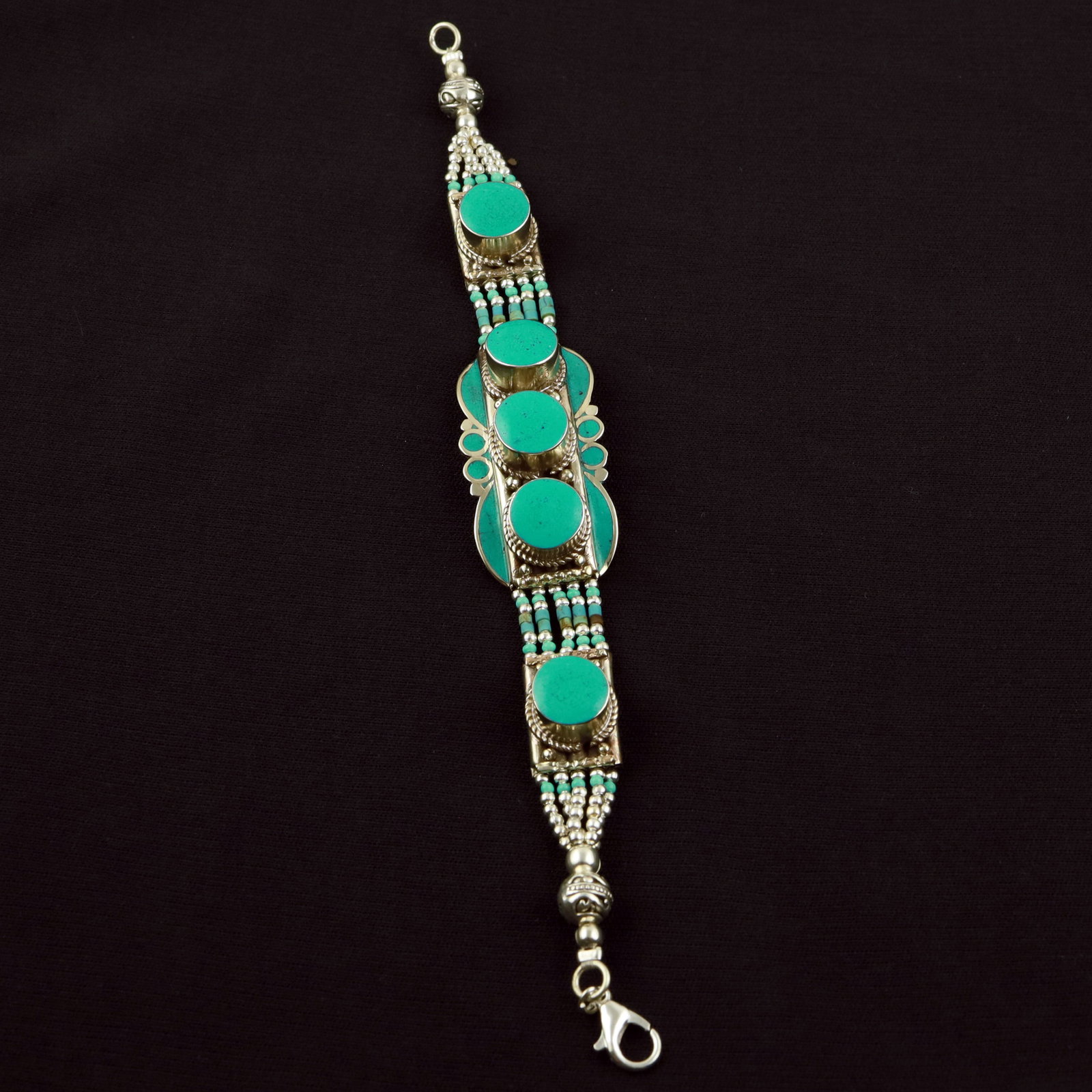 Tibetan Turquoise Handmade Designer Bracelet: Product ID: 260520113448 Product - Tibetan Handmade Ethnic Bracelet Gemstone - Natural Turquoise Size - 7 Inch Weight - 50 Gram Approx Metal - Brass & Copper mix Metal Origin - Nepal Country/Region of