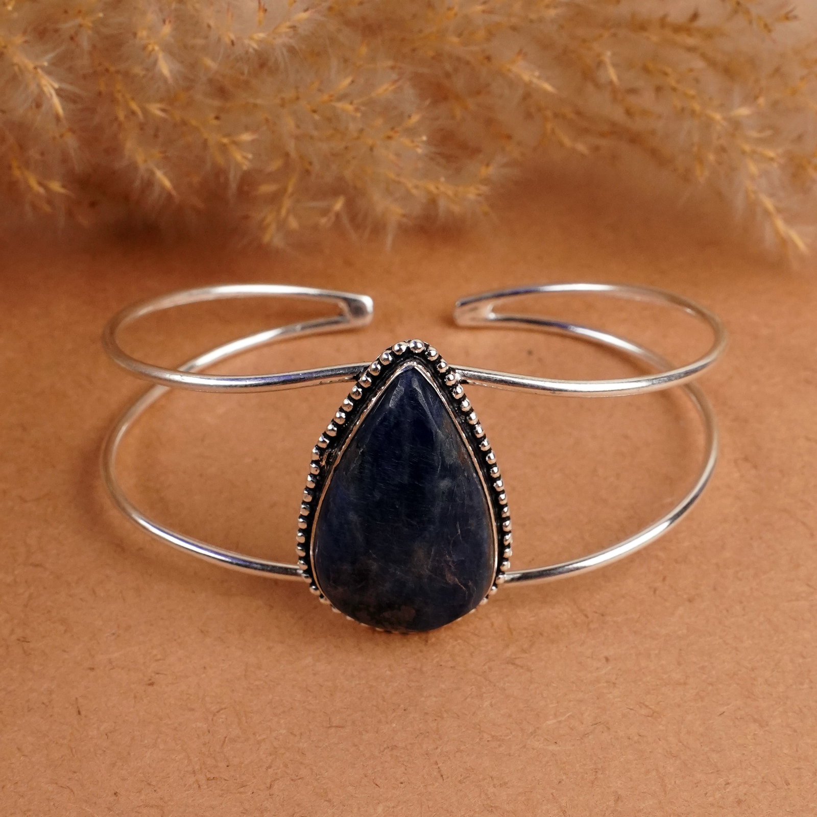 Natural Sodalite Sterling Silver Plated Handmade Cuff Bangle: Product ID: 260408144035 Product - Handmade Silver Plated Cuff Bangle Metal - 92.5 Sterling Silver Plated Bangle Size - 7x5 CM (Adjustable) Gemstone - Sodalite Gemstone Origin - Canada Gemstone Size -