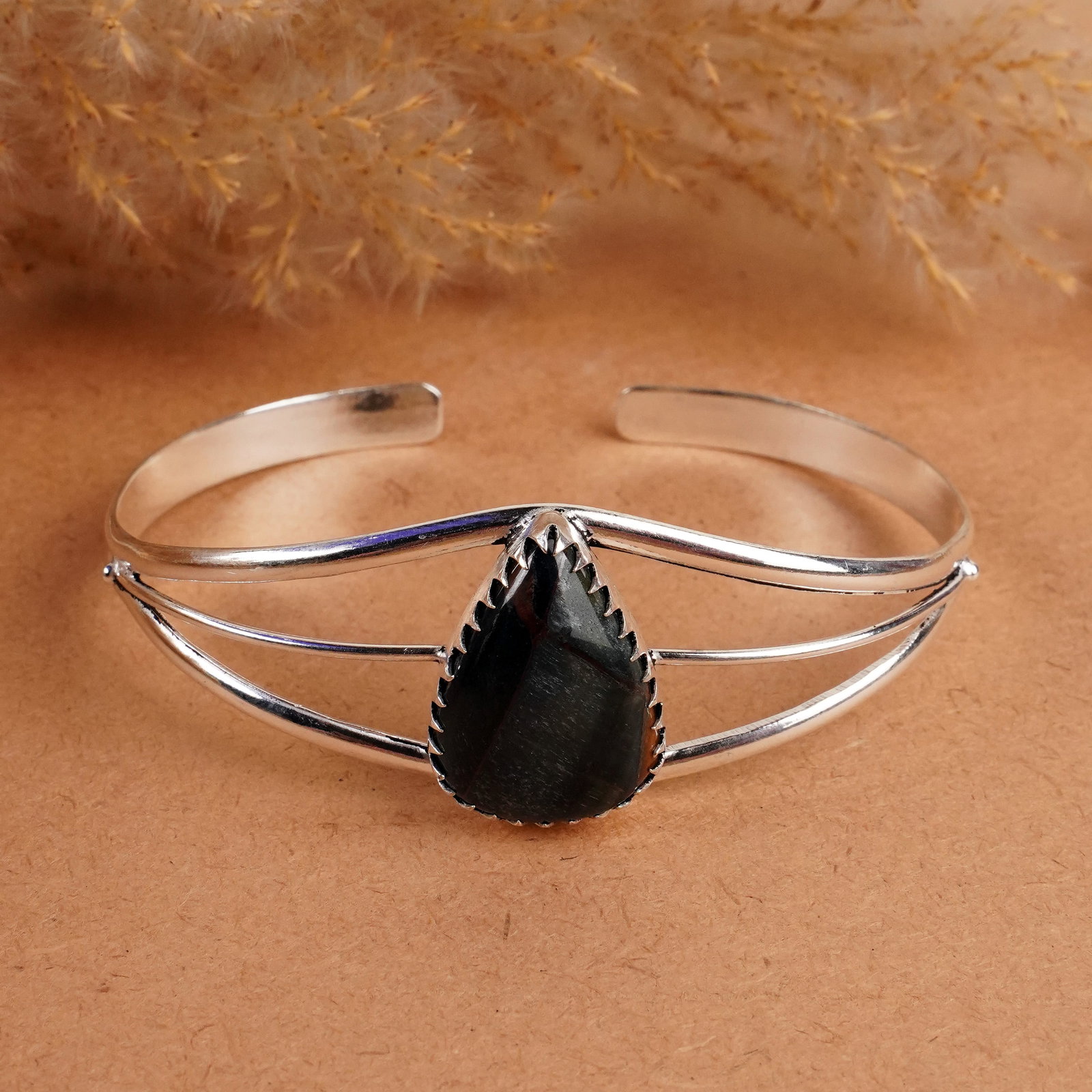 Natural Black Tiger Eye Sterling Silver Plated Handmade Cuff Bangle: Product ID: 260408141028 Product - Handmade Silver Plated Cuff Bangle Metal - 92.5 Sterling Silver Plated Bangle Size - 7.5x5.5 CM (Adjustable) Gemstone - Black Tiger Eye Gemstone Origin - South Afric