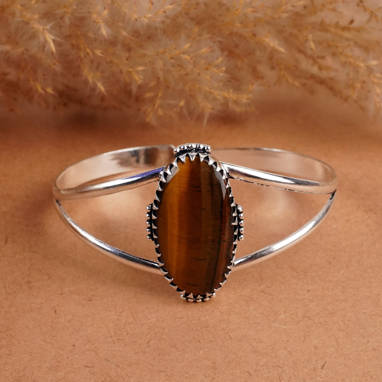 Natural Tiger Eye Sterling Silver Plated Handmade Cuff Bangle: Product ID: 260408142235 Product - Handmade Silver Plated Cuff Bangle Metal - 92.5 Sterling Silver Plated Bangle Size - 7x5.5 CM (Adjustable) Gemstone -Tiger Eye Gemstone Origin - South Africa Gemston