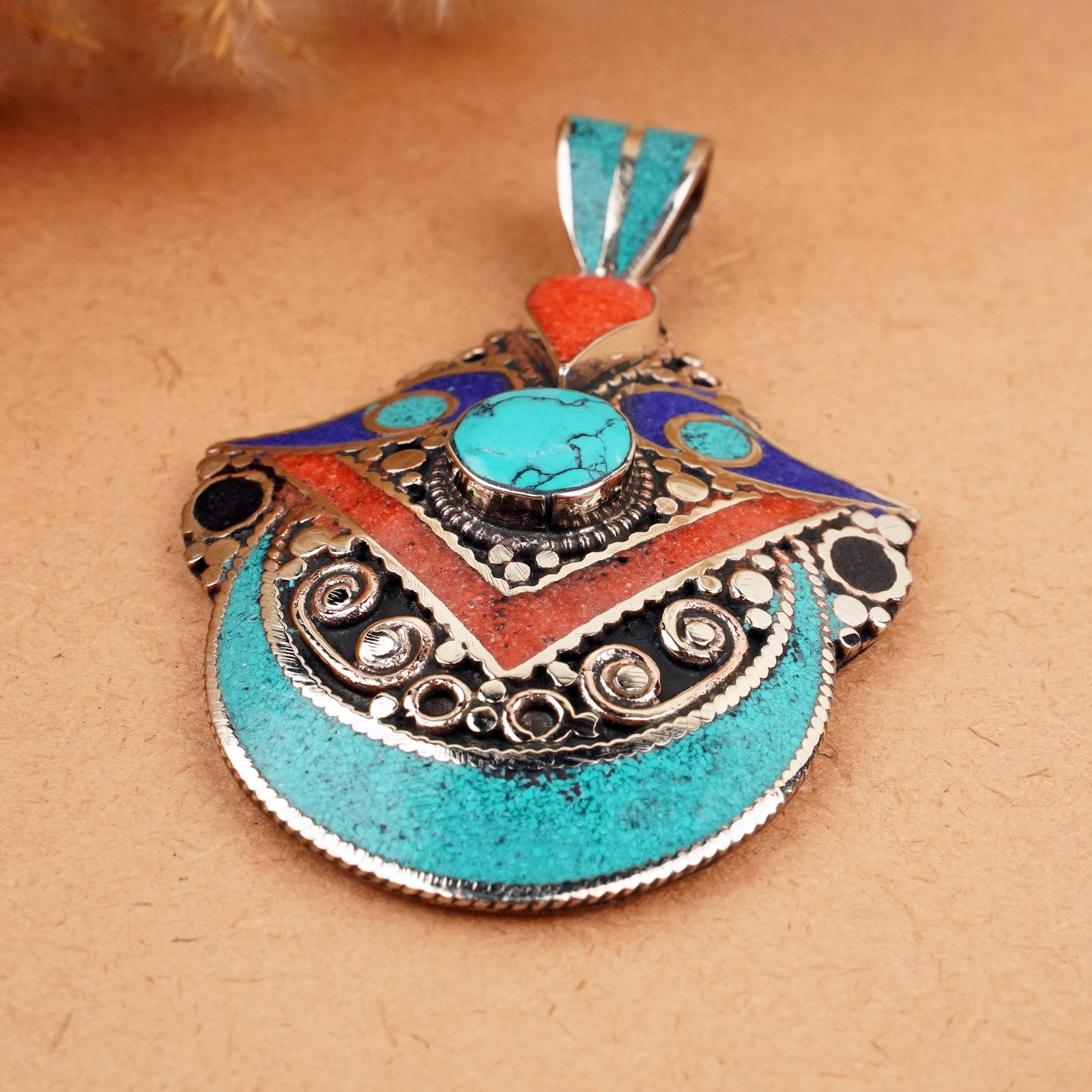 Tibetan Turquoise & Coral Handmade Ethnic Boho Pendant: Product ID: 260407150945 Product - Tibetan Handmade Ethnic Pendant Gemstone - Natural Turquoise & Coral Pendant Size - 6X4.5 CM Pendant Weight - 25 Gram Metal - Brass & Copper mix Metal Origin - Nepal