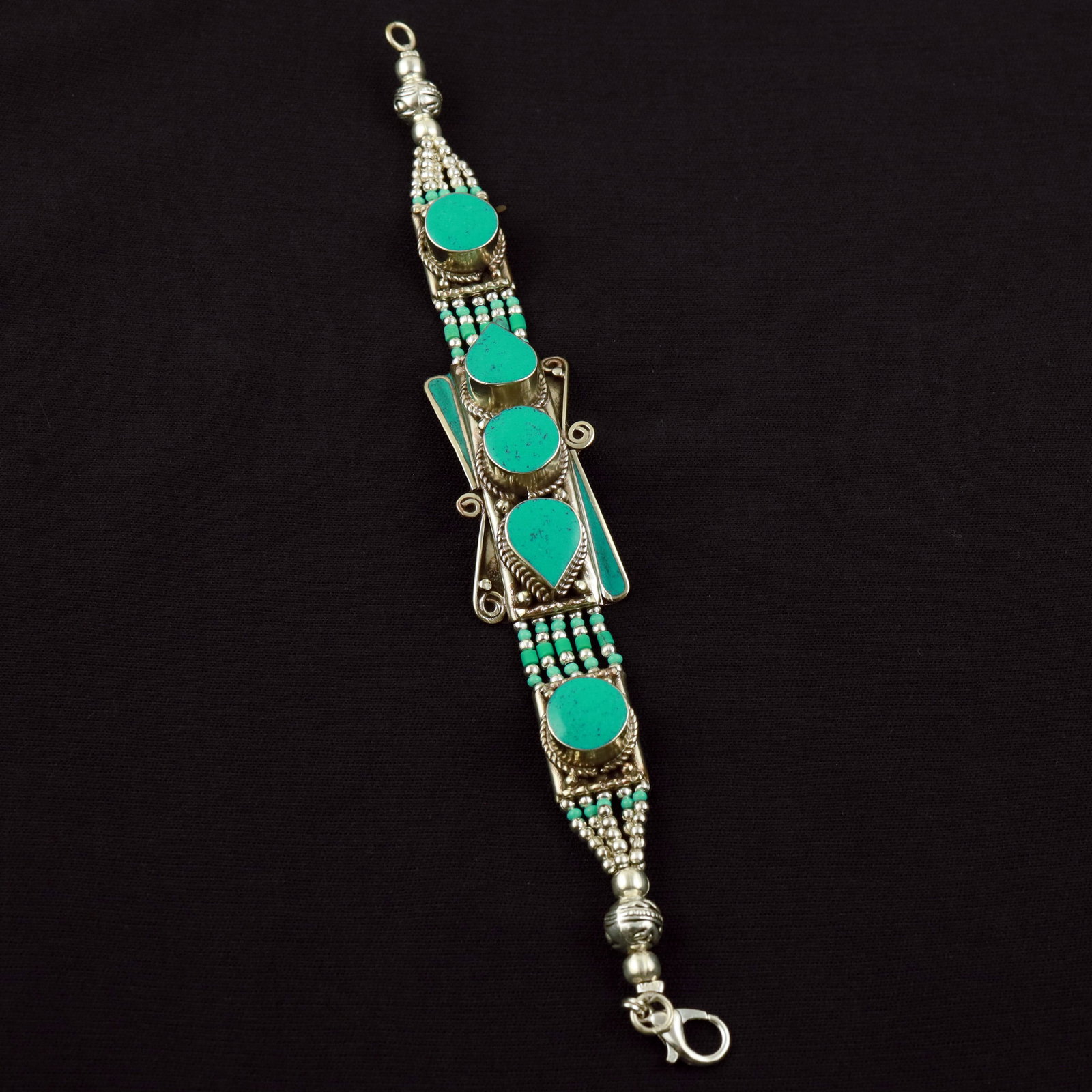 Tibetan Turquoise Handmade Ethnic Bold Bracelet: Product ID: 260520113512 Product - Tibetan Handmade Ethnic Bracelet Gemstone - Natural Turquoise Size - 7 Inch Weight - 50 Gram Approx Metal - Brass & Copper mix Metal Origin - Nepal Country/Region of
