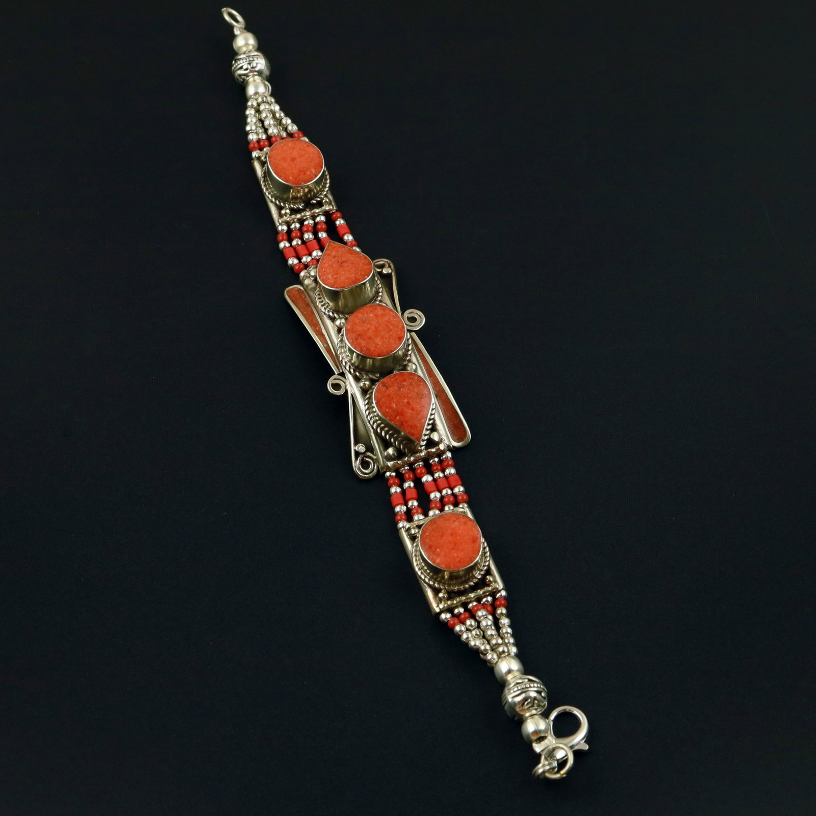 Tibetan Natural Red Coral Handcrafted Bold Bracelet: Product ID: 260513130731 Product - Tibetan Handmade Ethnic Bracelet Gemstone - Natural Coral Size - 7 Inch Weight - 50 Gram Approx Metal - Brass & Copper mix Metal Origin - Nepal Country/Region of Man