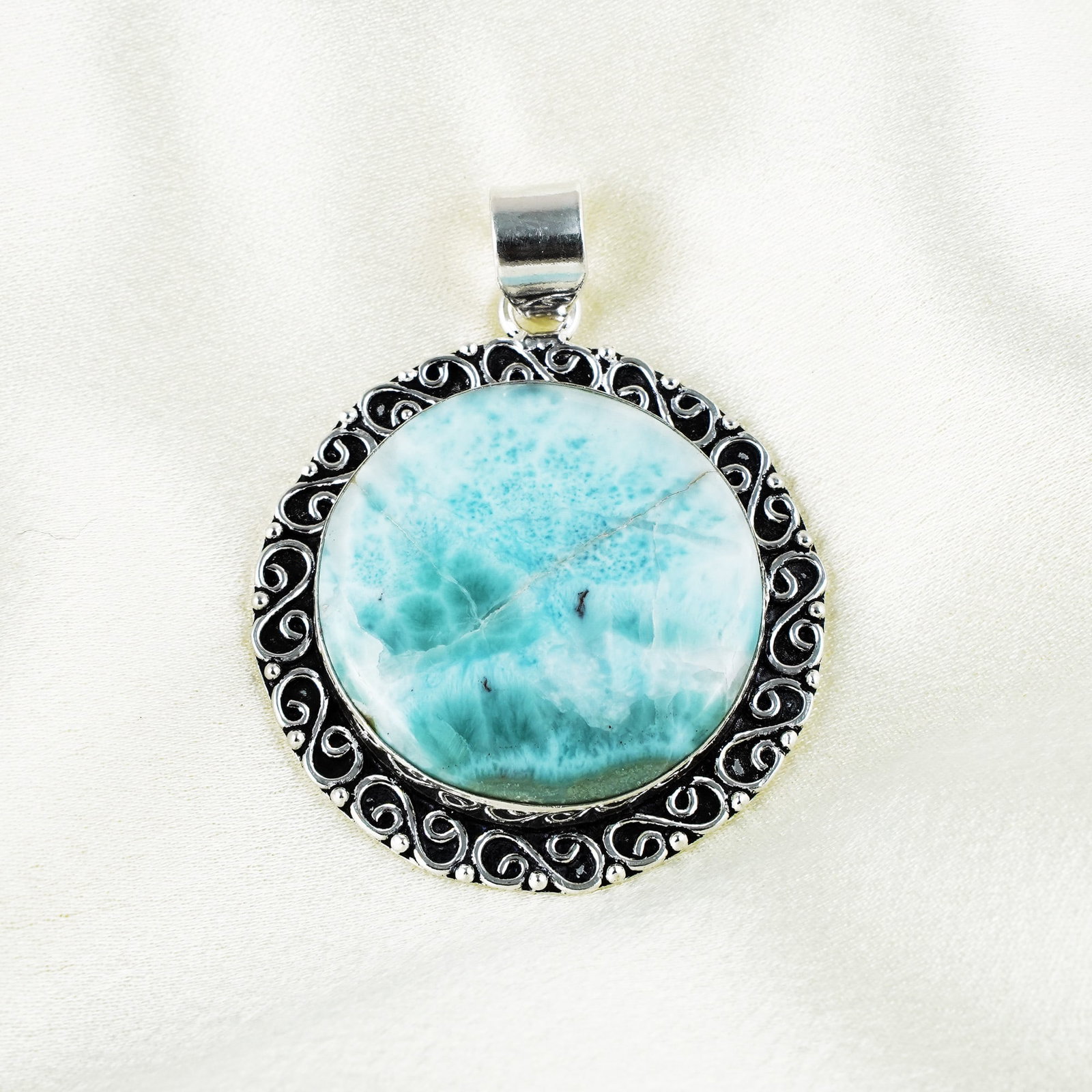 Natural Larimar Sterling Silver Plated Handmade Pendant: Product ID: 260401134103 Product - Handmade Silver Plated Pendant Metal - 92.5 Sterling Silver Plated Pendant Size - 4x4 CM Gemstone - Larimar Gemstone Origin - Dominican Republic Gemstone Shape - Ova
