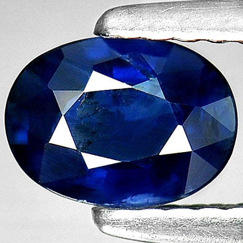 Natural Blue Sapphire Gemstones 0.75 Ct. Oval Shape 6.5 x 4.9 Mm.: Product ID: 806008204 Product Name: Natural Blue Sapphire Weight: 0.75 CT. Size: 6.5 x 4.9 x 2.6 MM. Shape: Oval Color: Blue Clarity:SI1 Luster: Good Gems Origin: Thailand Treatment: Heated Crystal St
