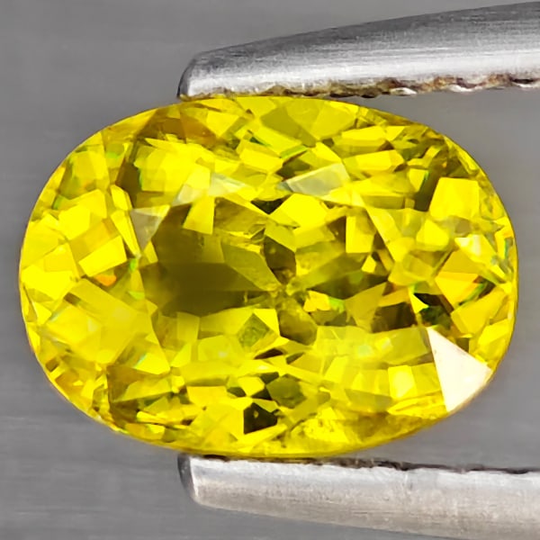 Natural Multi Color Sphene Gemstones Red Spark 1.30 Ct. Oval Shape 7.6 x 5.6 Mm.: Product ID: 806503406 Product Name: Natural Sphene Weight: 1.30 CT. Size: 7.6 x 5.6 x 4 MM. Shape: Oval Color: Multi Color With Red Spark Clarity:SI Luster: Adamantine Gems Origin: Mardagascar Treatme
