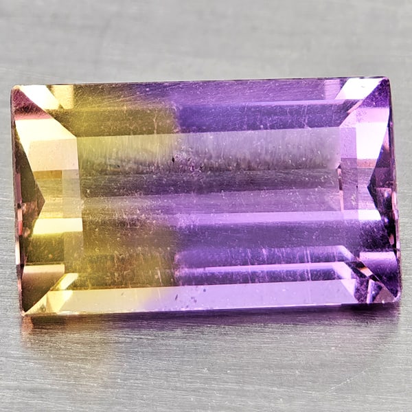 Natural Bi Color Ametrine Gemstones 1.96 Ct. Baguette Shape 10 x 6 Mm.: Product ID: 800408519 Product Name: Natural Ametrine Weight: 1.96 CT. Size: 10 x 6 x 4.2 MM. Shape: Baguette Color: Bi Color Clarity:VSI Luster: Good Gems Origin: Bolivia Treatment: Unheated Crystal S