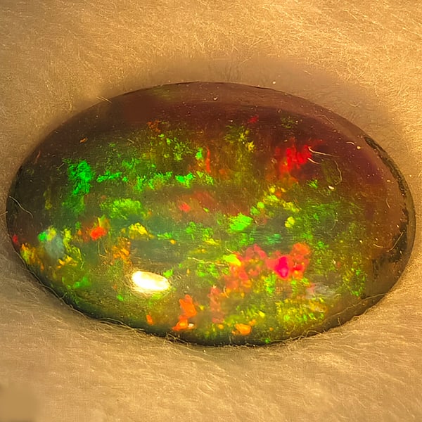 Natural Multi Color Opal Gemstones 1.32 Ct. Oval Cabochon Shape 11.10 x 8.01 Mm.: Product ID: 818728446 Product Name: Natural Opal Weight: 1.32 CT. Size: 11.10 x 8.01 x 3.24 MM. Shape: Oval Cabochon Color: Multi-Color Clarity:Semi - Transparent Luster: Good Gems Origin: Ethiopia Tr