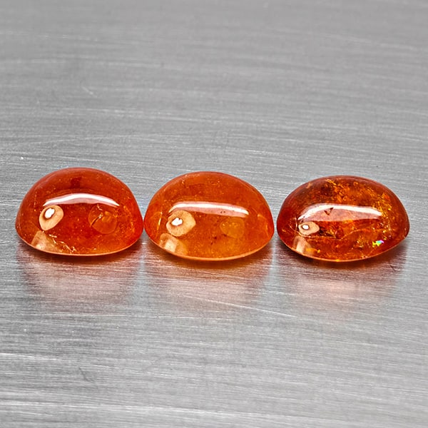Natural Orangish Red Spessartine Garnet Gemstones 15.60 Ct. 3Pcs Mixed Cabochon Shape and Mixed Size: Product ID: 802938039 Product Name: Natural Garnet Weight: 15.60 CT. Size: 10.7 x 8.2 x 5.6 to 10.2 x 7.7 x 6.1 MM. Shape: Mixed Shape Color: Orangish Red Clarity:SI1 Luster: Good Gems Origin: Namibia