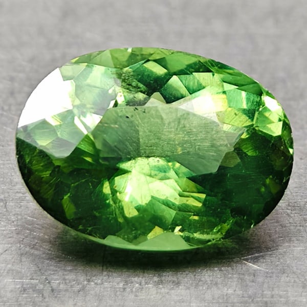 Natural Paraiba Color Green Apatite Gemstones 0.89 Ct. Oval Shape 7 x 5.2 Mm.: Product ID: 800613559 Product Name: Natural Apatite Weight: 0.89 CT. Size: 7 x 5.2 x 3.6 MM. Shape: Oval Color: Neon Green Clarity:VSI Luster: Very Good Gems Origin: Tanzania Treatment: Unheated Cryst