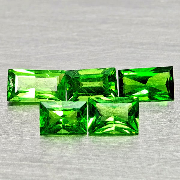 Natural Green Tsavorite Garnet Gemstones 0.93 Ct. 5 Pcs. Baguette Shape and Mixed Size: Product ID: 803005024 Product Name: Natural Tsavorite Weight: 0.93 CT. Size: 3.8 x 2.5 x 1.8 to 4.6 x 2.6 x 1.7 MM. Shape: Baguette Color: Green Clarity:SI1 Luster: Good Gems Origin: Tanzania Treatmen