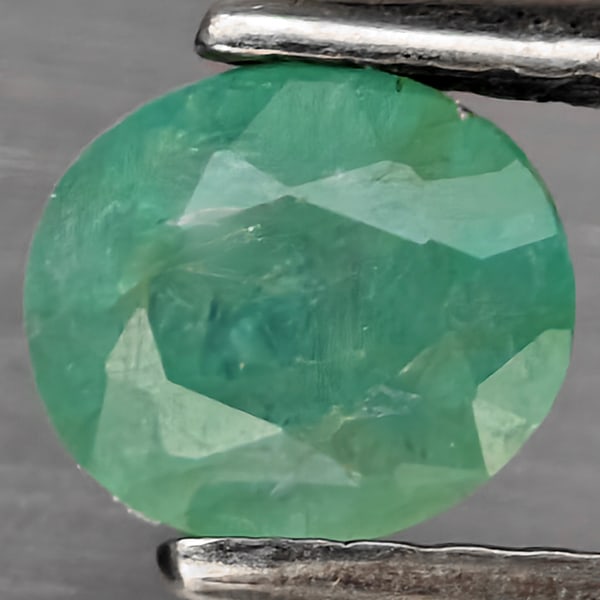 Natural Green Blueish Grandidierite Gemstones 1.04 Ct. Oval Shape 5.9 x 5.1 Mm.: Product ID: 803100088 Product Name: Natural Tsavorite Weight: 1.04 CT. Size: 5.9 x 5.1 x 4.2 MM. Shape: Oval Shape Color: Green Blueish Clarity:SI1 Luster: Good Gems Origin: Madagascar Treatment: Unhe