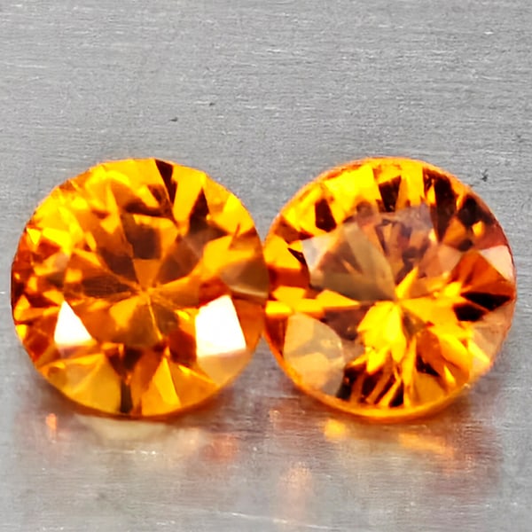Natural Orange Yellow Sapphire Gemstones 0.29 Ct. 2 Pcs. Round Diamond Cut 2.9 Mm.: Product ID: 806162869 Product Name: Natural Yellow Sapphire Weight: 0.29 CT. Size: 2.9 x 2.9 x 1.8 MM. Shape: Round Diamond Cut Color: Orange Yellow Clarity:VSI Luster: Good Gems Origin: Thailand Trea
