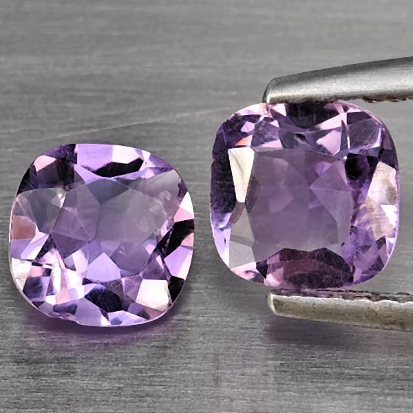 Natural Purple Amethyst Gemstones 1.58 Ct. 2 Pcs. Cushion Shape 6.4 Mm.: Product ID: 800325556 Product Name: Natural Amethyst Weight: 1.58 CT. Size: 6.4 x 6.4 x 3.7 MM. Shape: Cushion Shape Color: Purple Clarity:VSI Luster: Good Gems Origin: Brazil Treatment: Unheated Crys