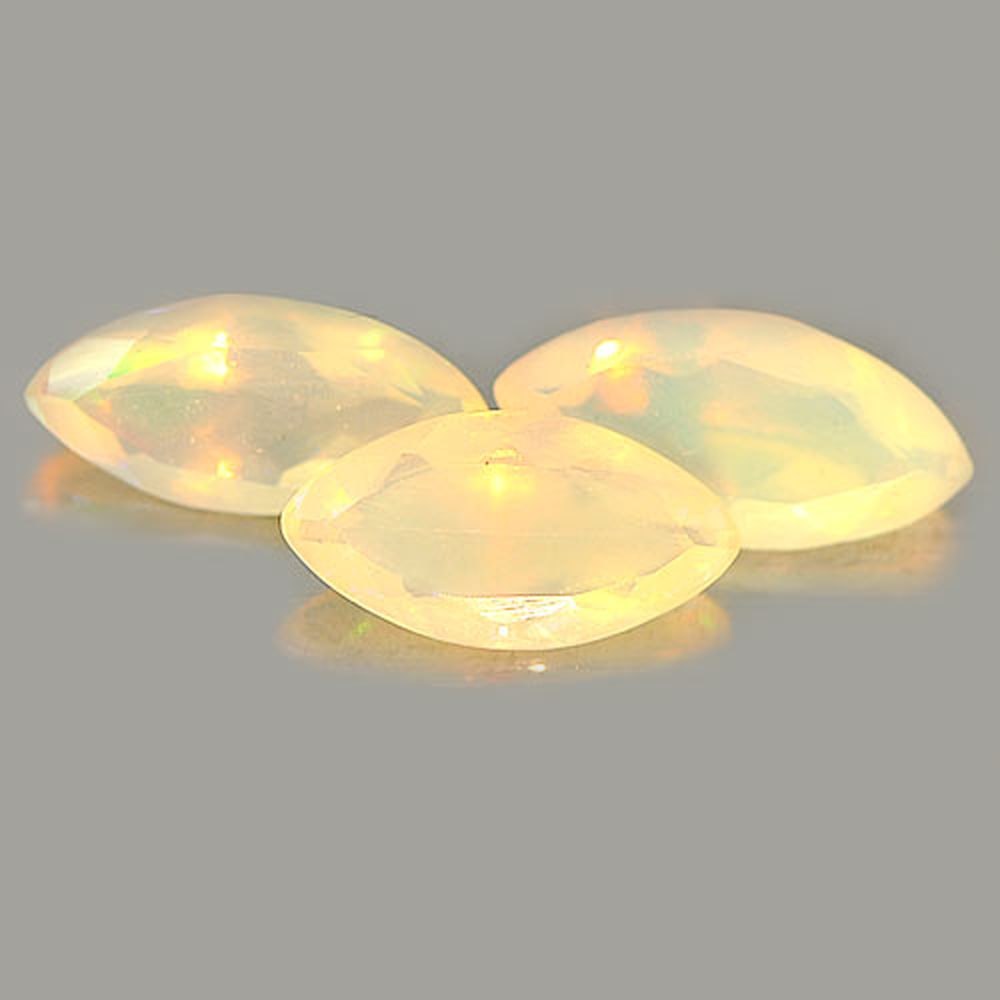 Natural Multi Color Opal Gemstones 1.45 Ct. 3 Pcs. Marquise Shape: Product ID: 818725351 Product Name: Natural Opal Weight: 1.45 CT. Size: 10 x 4.9 x 3.2 MM. Shape: Marquise Color: Multi-Color Clarity:Semi - Transparent Luster: Strong Iridescent Gems Origin: Ethiopia