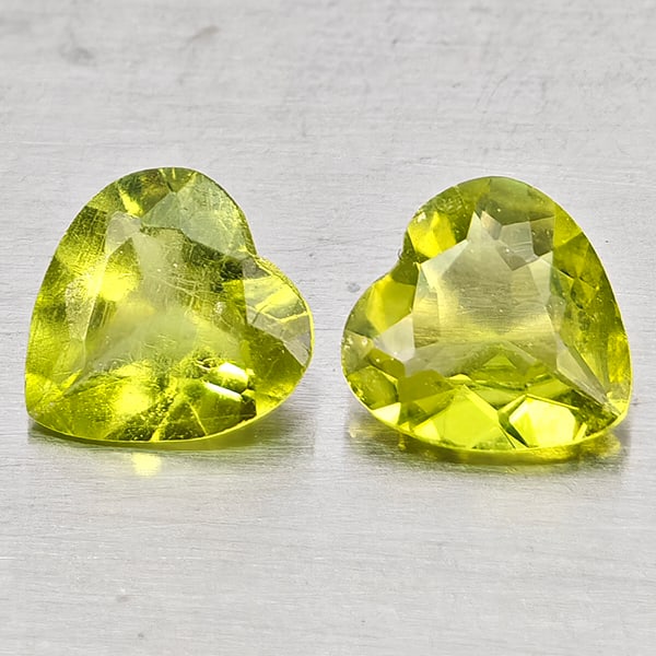 Natural Green Peridot Gemstones 1.26 Ct. 2 Pcs. Heart Shape 6 x 6 Mm.: Product ID: 805317323 Product Name: Natural Peridot Weight: 1.26 CT. Size: 6 x 6 x 2.5 MM. Shape: Heart Shape Color: Green Clarity:VSI - SI1 Luster: Good Gems Origin: Pakistan Treatment: Unheated Crys