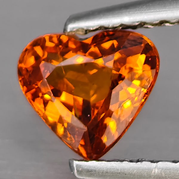 Natural Reddish Orange Spessartine Garnet Gemstones 0.80 Ct. Heart Shape 5.8 x 5.5 Mm.: Product ID: 802937852 Product Name: Natural Spessartine Weight: 0.80 CT. Size: 5.8 x 5.5 x 3.3 MM. Shape: Heart Shape Color: Reddish Orange Clarity:SI1 Luster: Good Gems Origin: Namibia Treatment: Unh