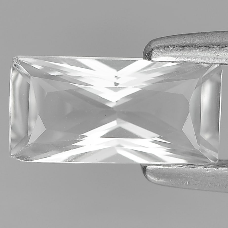 Natural White Topaz Gemstones 0.94 Ct. Baguette Princess Cut 8 x 4 Mm.: Product ID: 807167484 Product Name: Natural Topaz Weight: 0.94 CT. Size: 8 x 4 x 3.2 MM. Shape: Baguette Princess Cut Color: White Clarity:VSI Luster: Good Gems Origin: Brazil Treatment: Unheated Crys