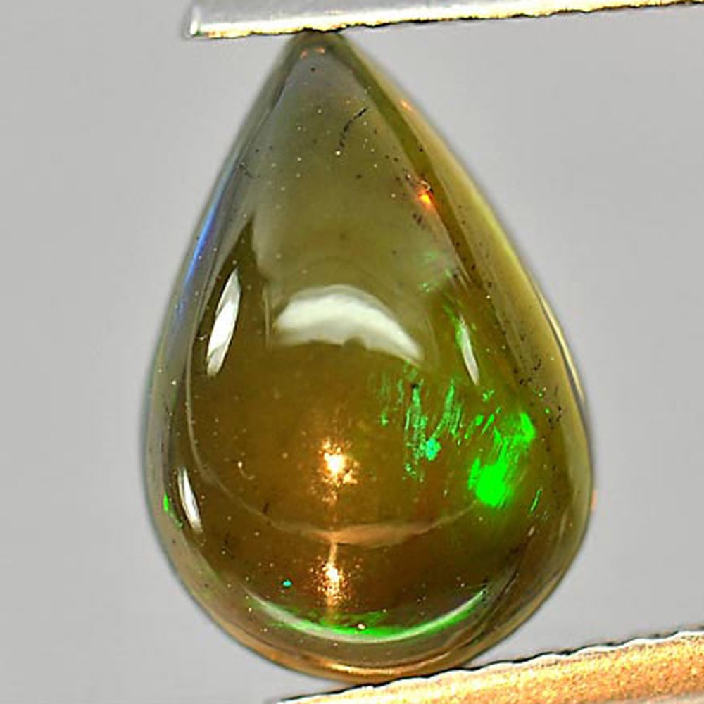 Natural Play Of Color Rainbow Fire Red Black Opal Gemstones 2.27 Ct. Pear Cabochon Shape 12 x 8.3 Mm: Product ID: 818724298 Product Name: Natural Opal Weight: 2.27 CT. Size: 12 x 8.3 x 5.2 MM. Shape: Pear Cabochon Color: Multi-Color Clarity:Semi - Transparent Luster: Iridescent Gems Origin: Ethiopia T