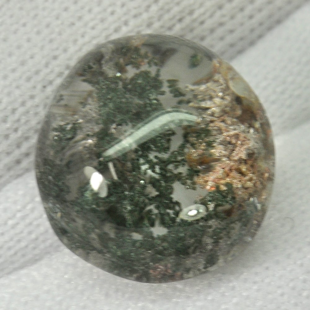 Natural White Black Moss Quartz Gemstones 8.54 Ct. Oval Cabochon Shape 12.9 x 12.2 Mm.: Product ID: 805529471 Product Name: Natural Quartz Weight: 8.54 CT. Size: 12.9 x 12.2 x 8.5 MM. Shape: Oval Cabochon Color: White Clarity:Semi - Transparent Luster: Good Gems Origin: Thailand Treatmen