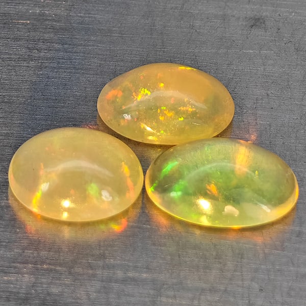 Natural Multi-Color Opal Gemstones 1.77 Ct. 3 Pcs. Oval Cabochon Shape 7.1 x 5.1 Mm.: Product ID: 818728309 Product Name: Natural Opal Weight: 1.77 CT. Size: 7.1 x 5.1 x 3 MM. Shape: Oval Cabochon Color: Multi-Color Clarity:None Luster: Good Gems Origin: Ethiopia Treatment: Unheated Cr