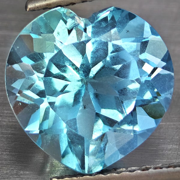 Natural Baby Blue Topaz Gemstones 5.63 Ct. Heart Shape 11.2 Mm.: Product ID: 807168756 Product Name: Natural Blue Topaz Weight: 5.63 CT. Size: 11.2 x 11.2 x 6.6 MM. Shape: Heart Shape Color: Baby Blue Clarity:VSI Luster: Good Gems Origin: Brazil Treatment: Treated 