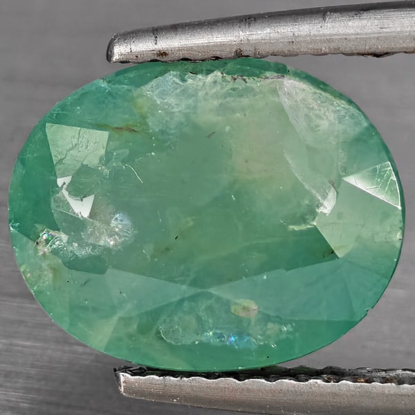 Natural Green Blueish Grandidierite Gemstones 3.76 Ct. Oval Shape 11.4 x 9.4 Mm.: Product ID: 803100014 Product Name: Natural Tsavorite Weight: 3.76 CT. Size: 11.4 x 9.4 x 5.5 MM. Shape: Oval Shape Color: Green Blueish Clarity:SI1 Luster: Good Gems Origin: Madagascar Treatment: Unh