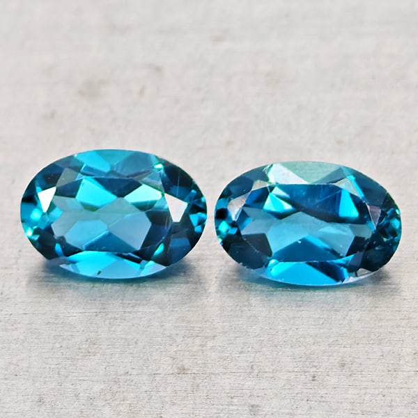 Natural London Blue Topaz Gemstones 0.96 Ct. 2 Pcs. Oval Shape 6 x 4 Mm.: Product ID: 807168469 Product Name: Natural Blue Topaz Weight: 0.96 CT. Size: 6 x 4 x 2.2 MM. Shape: Oval Shape Color: London Blue Clarity:VSI - SI1 Luster: Good Gems Origin: Brazil Treatment: Treated