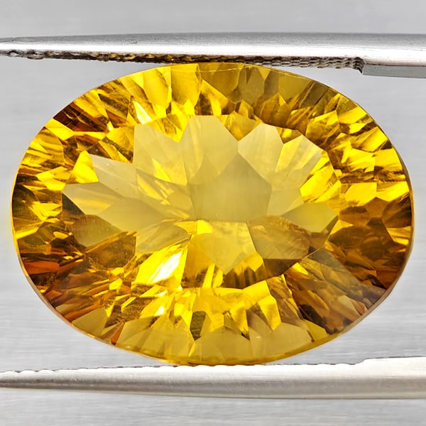 Natural Yellow Citrine Gemstone 15.17 Ct. Oval Concave Cut 19 x 14.5 Mm.: Product ID: 801815410 Product Name: Natural Citrine Weight: 15.17 CT. Size: 19 x 14.5 x 10 MM. Shape: Oval Concave Color: Yellow Clarity:VSI Luster: Very Good Gems Origin: Brazil Treatment: Unheated C
